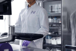 Nightingale Health laboratory specialist working on a computer.